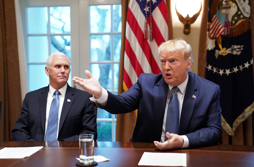 US President Donald Trump talks as Vice President Mike Pence listens during a roundtable on deregulation in the cabinet room at the White House in Washington December 16, 2019. u00e2u20acu201d Reuters pic