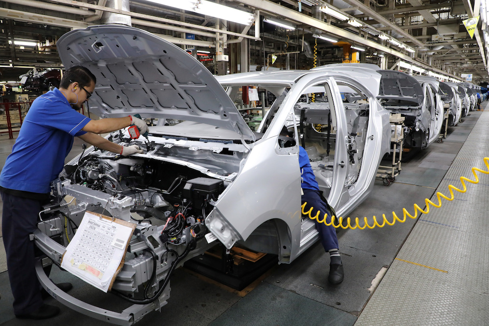 Employees work at an assembly line in the Proton manufacturing plant in Tanjung Malim December 16, 2019. u00e2u20acu201d Reuters pic