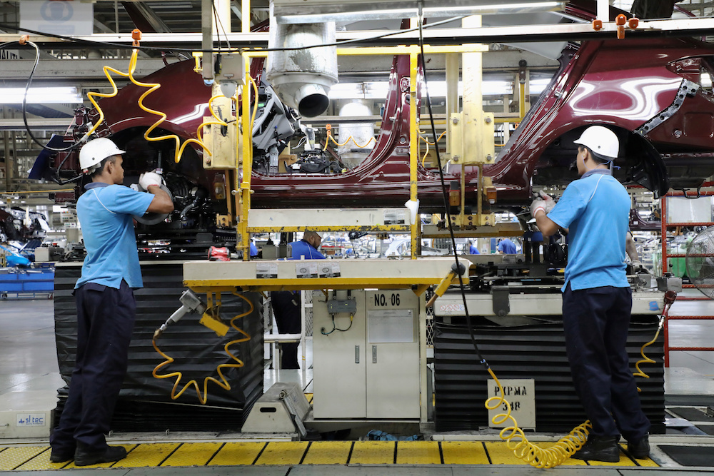 Employees work at an assembly line in the Proton manufacturing plant in Tanjung Malim December 16, 2019. u00e2u20acu201d Reuters pic