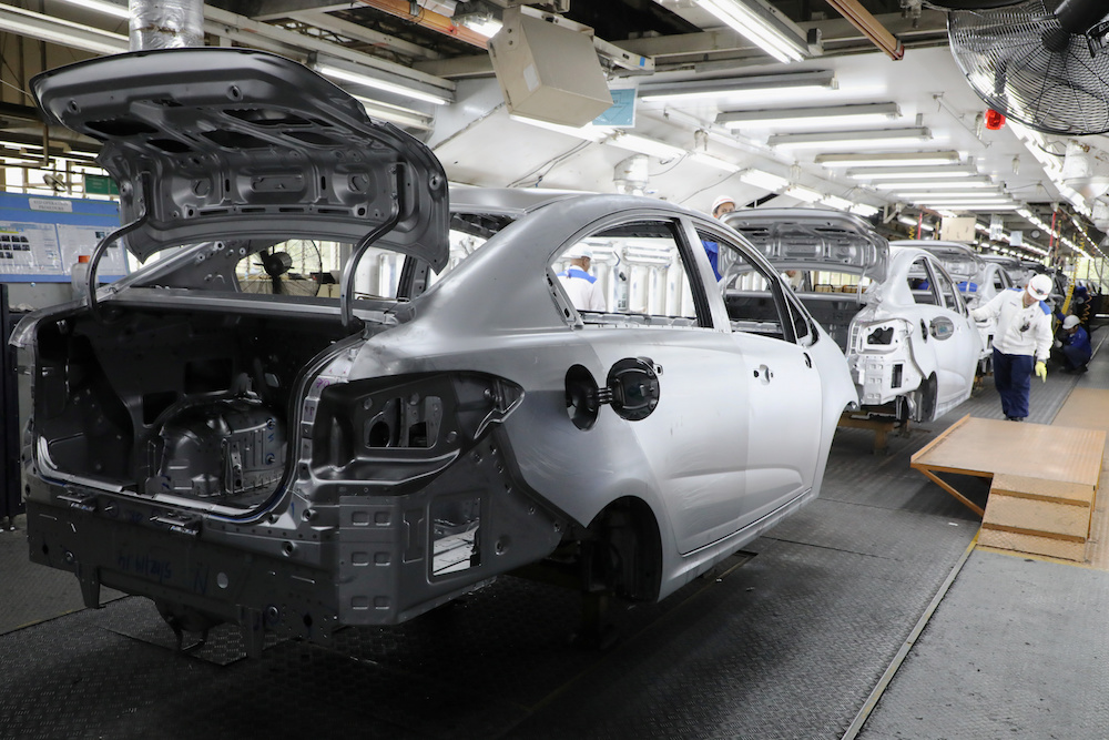 Employees work at an assembly line in the Proton manufacturing plant in Tanjung Malim December 16, 2019. u00e2u20acu201d Reuters pic