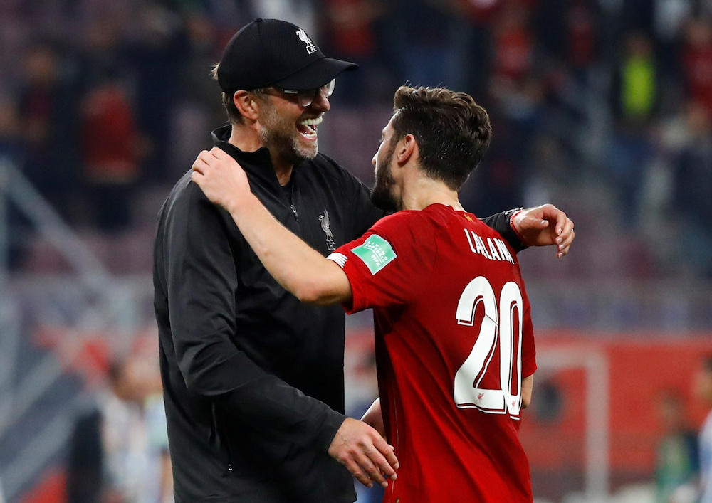 Liverpool manager Jurgen Klopp celebrates with Adam Lallana after the Club World Cup semi-final match with Monterrey at Khalifa International Stadium in Doha December 18, 2019. u00e2u20acu201d Reuters pic