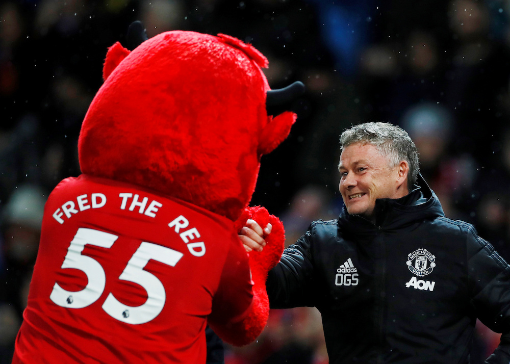 Manchester United manager Ole Gunnar Solskjaer shakes hands with the mascot before the Carabao Cup quarter-final match with Colchester United at Old Trafford in Manchester December 18, 2019. u00e2u20acu201d Action Images pic via Reuters