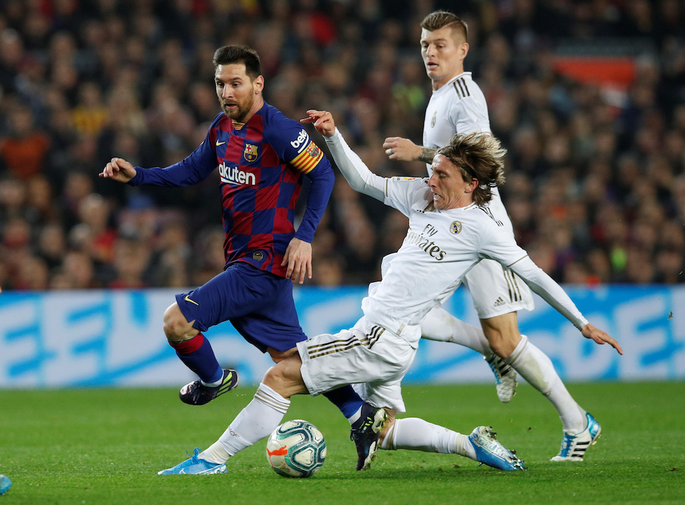 Barcelonau00e2u20acu2122s Lionel Messi in action with Real Madridu00e2u20acu2122s Luka Modric during their La Liga match at Camp Nou in Barcelona December 18, 2019. u00e2u20acu201d Reuters pic