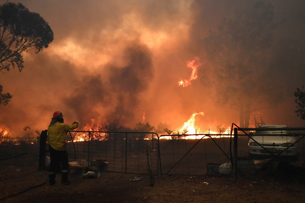 Rural Fire Service crews engage in property protection of a number of homes along the Old Hume Highway in the southwest of Sydney December 19, 2019. u00e2u20acu201d AAP Image/Dean Lewins via Reuters