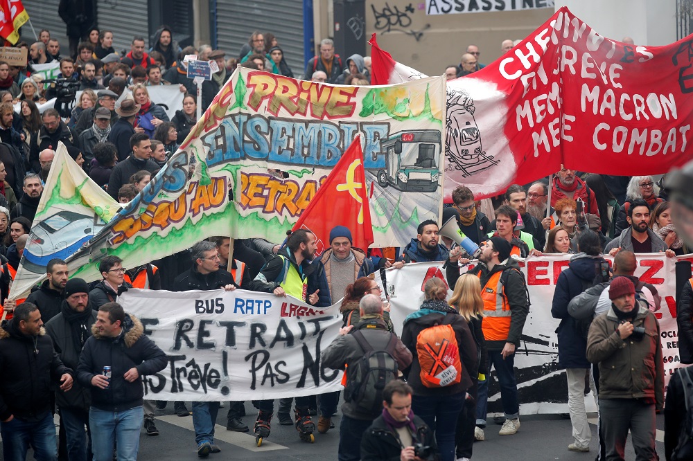 French labour union members and workers on strike attend a demonstration in Paris as France faces its 15th day of consecutive strikes against French government's pensions reform plans, December 19, 2019. — Reuters pic