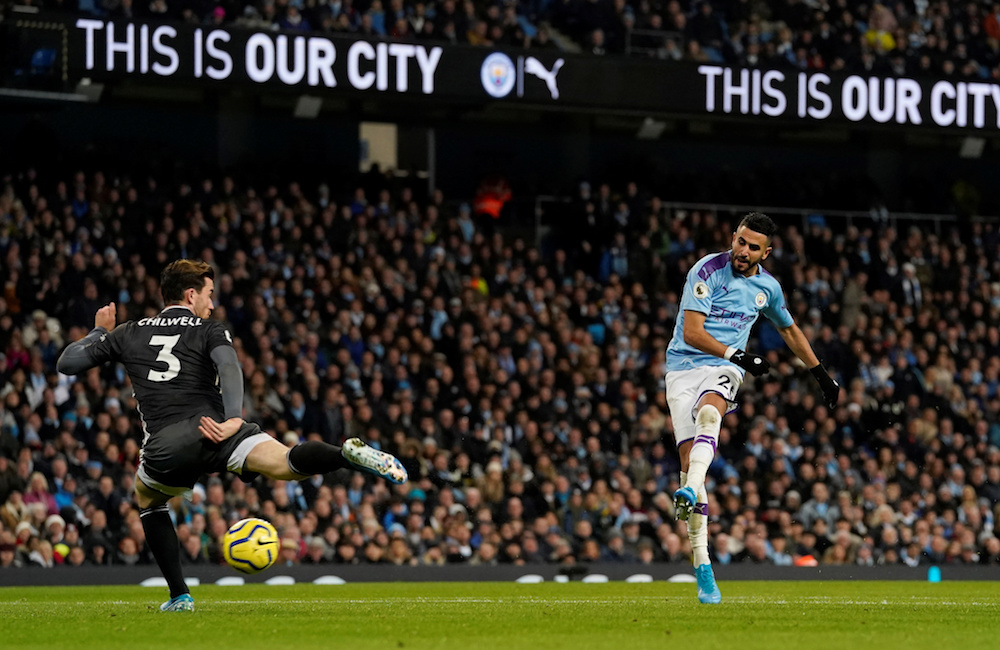 Manchester City’s Riyad Mahrez shoots at goal as Leicester City’s Ben Chilwell attempts to block during their Premier League match at Etihad Stadium in Manchester December 21, 2019. — Action Images pic via Reuters