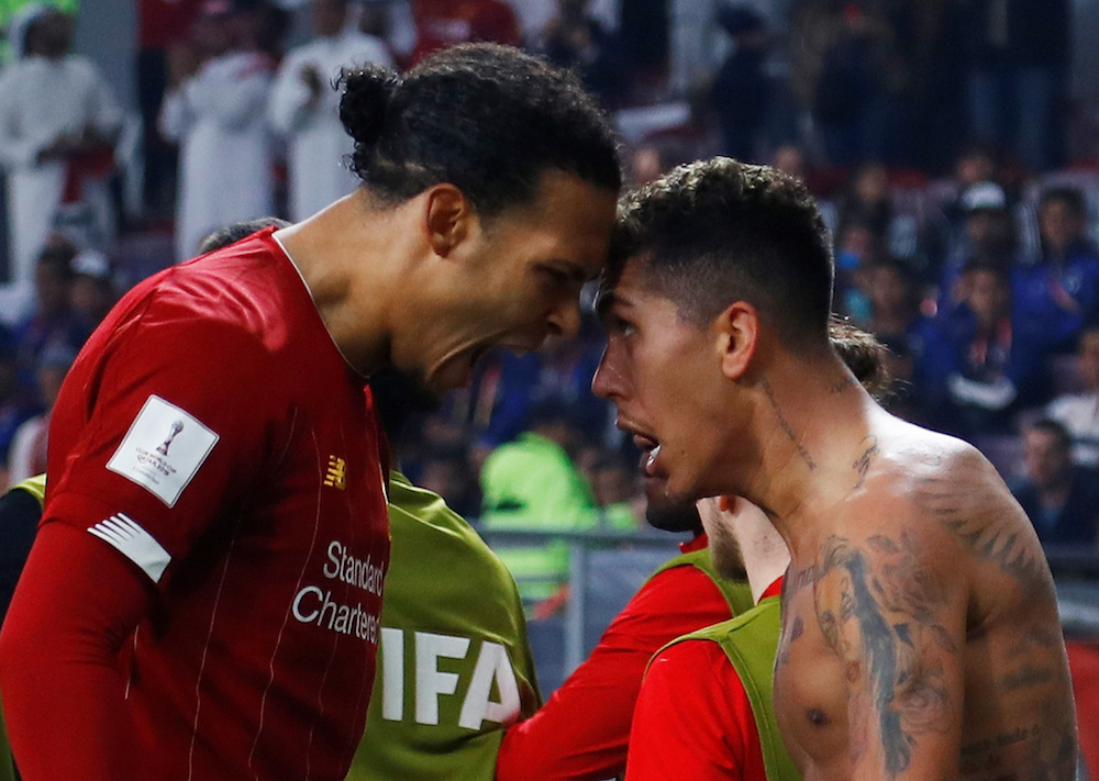 Liverpool’s Roberto Firmino celebrates scoring their first goal with Virgil van Dijk during the Club World Cup Final with Flamengo at Khalifa International Stadium in Doha December 21, 2019. — Reuters pic