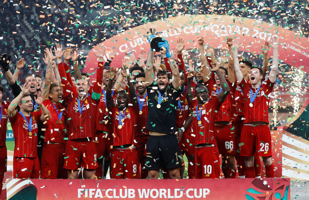 Liverpoolu00e2u20acu2122s Alisson lifts the trophy as they celebrate after winning the Club World Cup Final with Flamengo at Khalifa International Stadium in Doha December 21, 2019. u00e2u20acu201d Reuters pic
