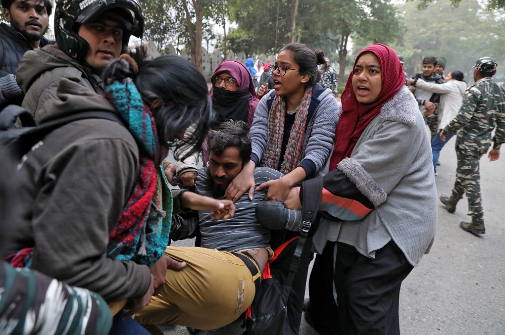 Demonstrators try to save a fellow demonstrator from being detained by police during a protest against a new citizenship law, in New Delhi December 27, 2019. u00e2u20acu201d Reuters pic