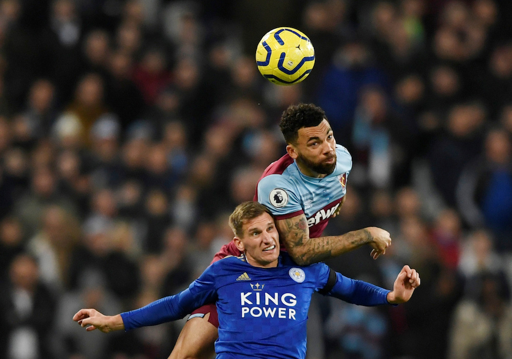 Leicester Cityu00e2u20acu2122s Marc Albrighton in action with West Ham Unitedu00e2u20acu2122s Ryan Fredericks during their Premier League match at London Stadium in London December 28, 2019. u00e2u20acu201d Action Images pic via Reuters