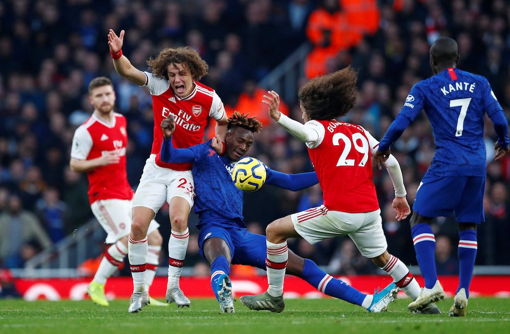 Arsenal’s David Luiz and Matteo Guendouzi in action with Chelsea’s Tammy Abraham during their Premier League match at Emirates Stadium in London December 29, 2019. — Reuters pic