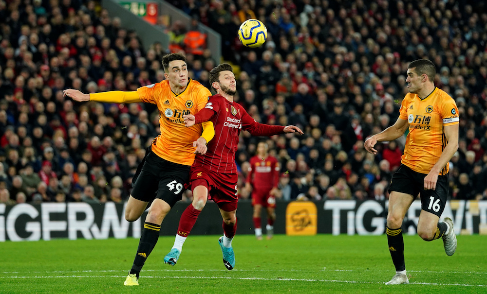 Liverpoolu00e2u20acu2122s Adam Lallana in action with Wolverhampton Wanderersu00e2u20acu2122 Max Kilman before Liverpoolu00e2u20acu2122s Sadio Mane scored their first goal during their Premier League match at Anfield in Liverpool December 29, 2019. u00e2u20acu201d Reuters pic