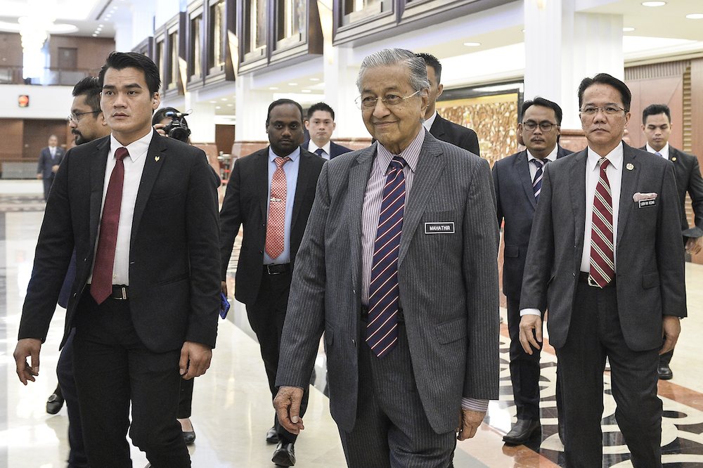 Prime Minister Tun Dr Mahathir Mohamad leaves Parliament December 3, 2019. u00e2u20acu201d Picture by Miera Zulyana