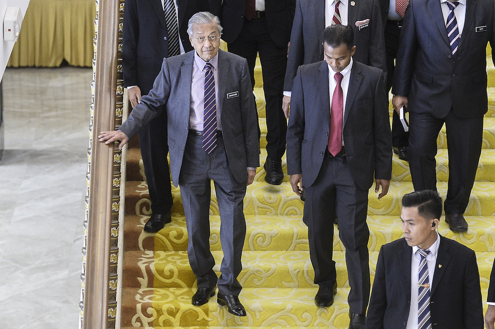 Prime Minister Tun Dr Mahathir Mohamad leaves Parliament December 3, 2019. u00e2u20acu201d Picture by Miera Zulyana