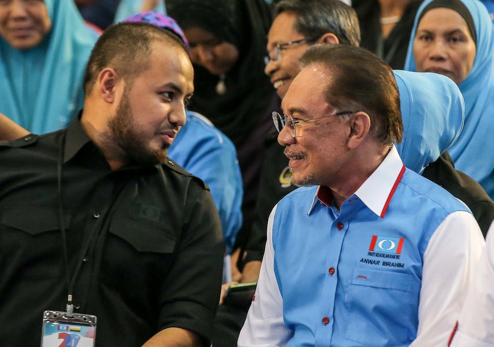 Perak PKR chief Farhash Wafa Salvador Rizal Mubarak and PKR president Datuk Seri Anwar Ibrahim attend the Perak PKR Convention in Kuala Kangsar December 3, 2019. — Picture by Farhan Najib