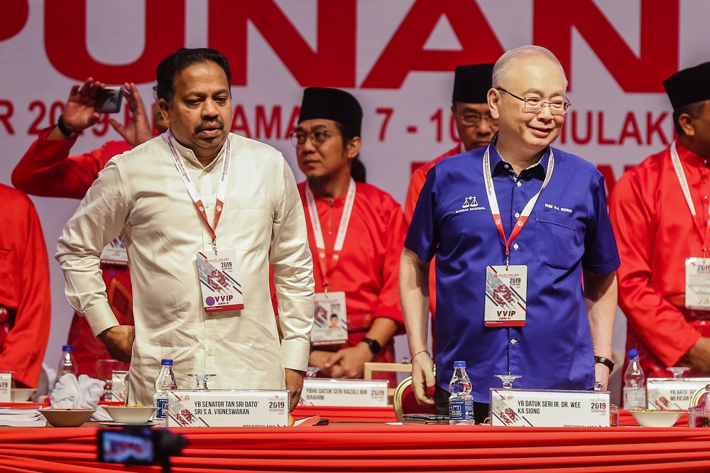 MIC president SA Vigneswaran (left) and MCA president Wee Ka Siong (right) attend the opening ceremony of the Umno General Assembly at Putra World Trade Centre in Kuala Lumpur December 6, 2019. u00e2u20acu201d Picture by Firdaus Latif