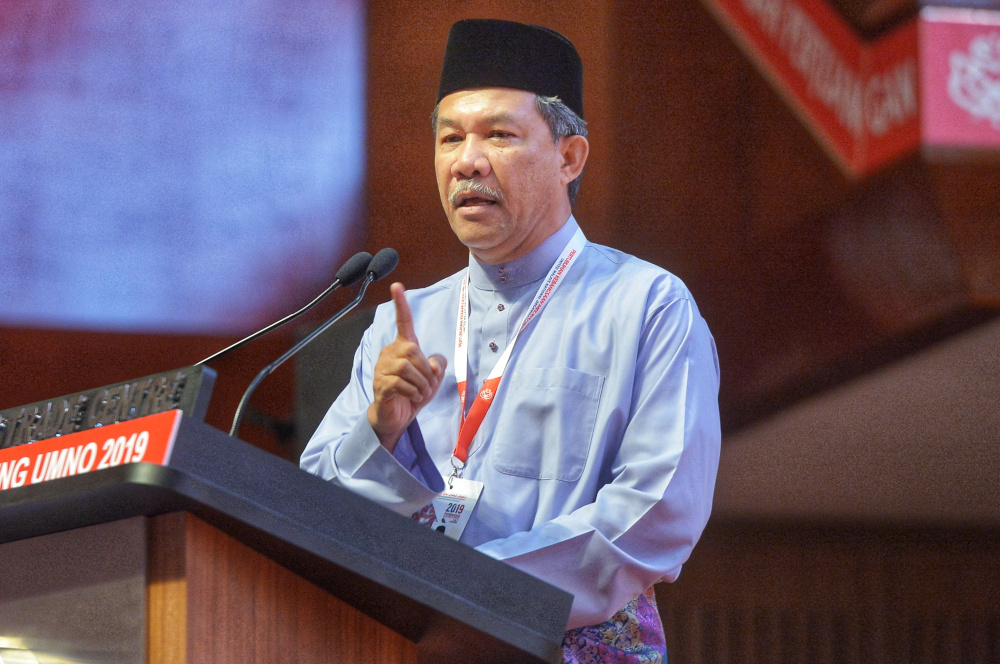 Umno deputy president Datuk Seri Mohamad Hasan delivers his speech during the Umno General Assembly 2019 at PWTC in Kuala Lumpur December 7, 2019 u00e2u20acu201d Picture by Shafwan Zaidon
