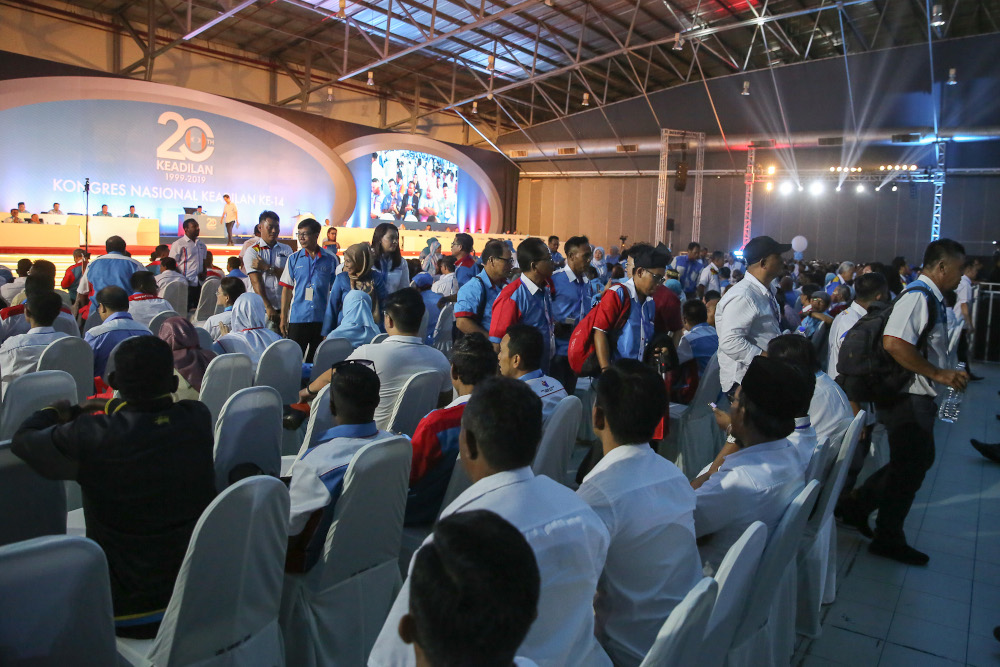 Delegates walk out from main hall during the 2019 PKR National Congress at MITC in Melaka December 7, 2019. — Picture by Yusof Mat Isa