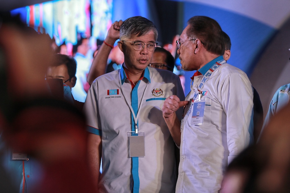 Chua Tian Chang and Datuk Seri Anwar Ibrahim interact during the 2019 PKR National Congress at MITC in Ayeh Keroh, Melaka December 8, 2019. — Picture by Ahmad Zamzahuri