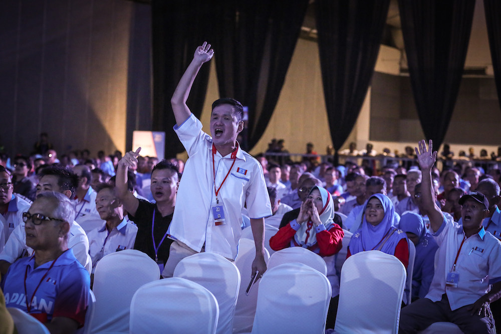 Delegates react as they listen to a speech by PKR vice-president Chua Tian Chang during the 2019 PKR National Congress at MITC in Ayer Keroh, Melaka December 8, 2019. — Picture by Yusof Mat Isa