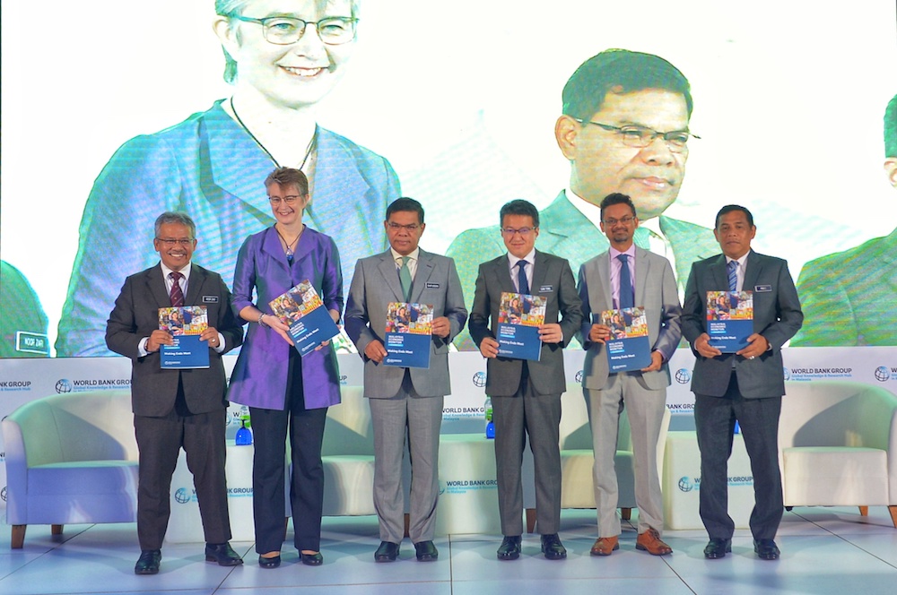 Datuk Seri Saifuddin Nasution Ismail and Liew Chin Tong officiate the launch of the World Banku00e2u20acu2122s Malaysia Economic Monitor report in Kuala Lumpur December 9, 2019. u00e2u20acu201d Picture by Shafwan Zaidon