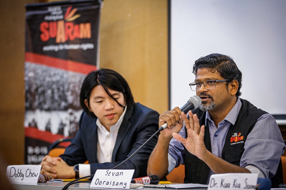 Suaram executive director Sevan Doraisamy (right) speaks during a press conference in Kuala Lumpur December 9, 2019. — Picture by Hari Anggara