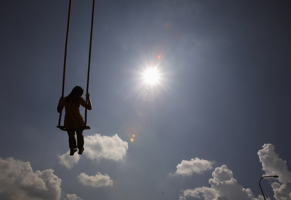 A girl plays on a swing during the Hindu festival of Dasain in Kathmandu September 29, 2011.u00e2u20acu201dReuters pic