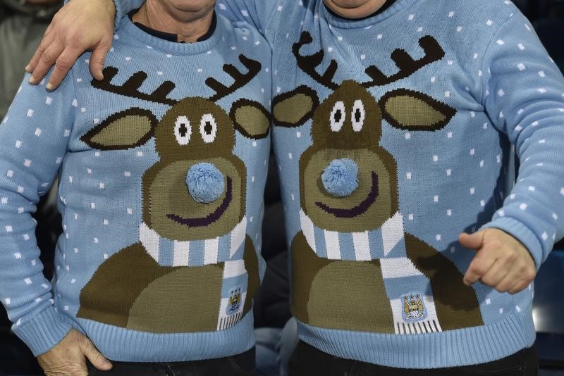 Fans wear Christmas jumpers during a football match in West Bromwich, central England December 26, 2014. u00e2u20acu201d Reuters pic