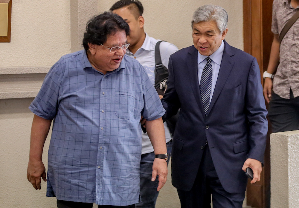 Tengku Adnan Mansor and Datuk Seri Ahmad Zahid Hamidi are seen at the Kuala Lumpur High Court December 11, 2019. — Picture by Firdaus Latif