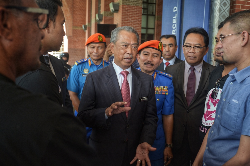 Home Minister Tan Sri Muhyiddin Yassin speaks to reporters after flagging off the Floods Humanitarian Mission by the Anak Muda NGO in Putrajaya December 11, 2019. u00e2u20acu201d Picture by Shafwan Zaidon