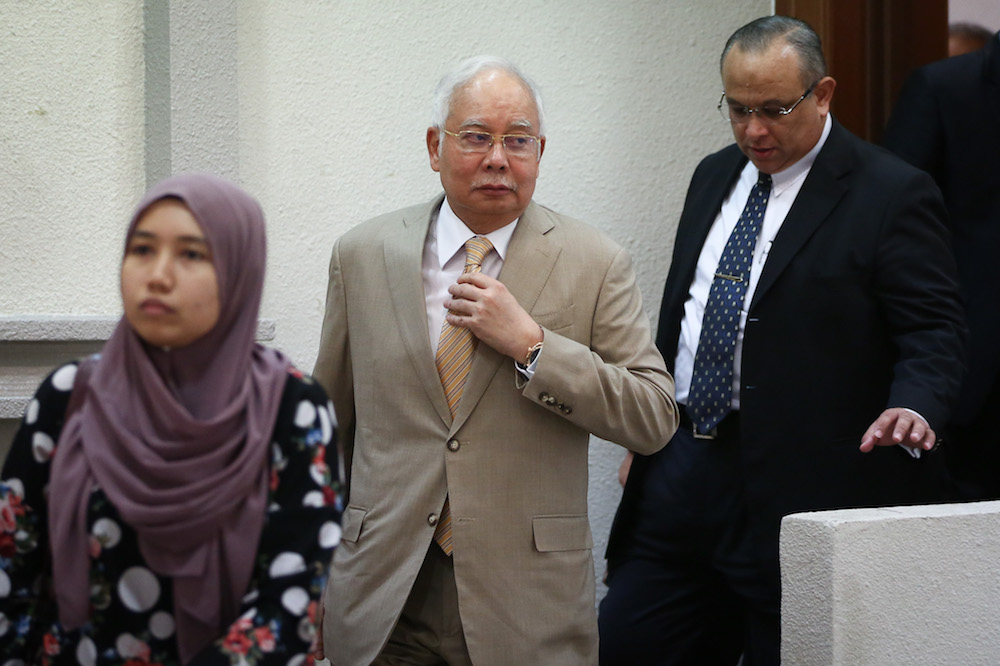 Former prime minister Datuk Seri Najib Razak leaves the courtroom for a short recess during his trial at the Kuala Lumpur High Court December 11, 2019. u00e2u20acu201d Picture by Yusof Mat Isa