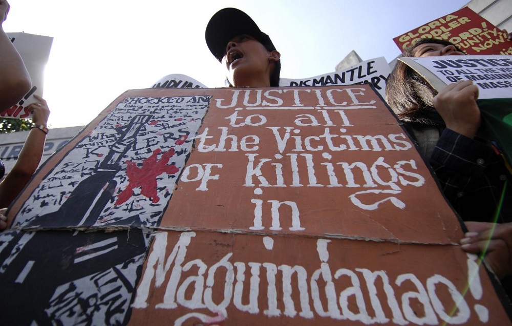 nHuman rights advocates holding a protest in front of the Philippine National Police headquarters in Camp Crame, Quezon City January 13, 2009. u00e2u20acu201d AFP picn