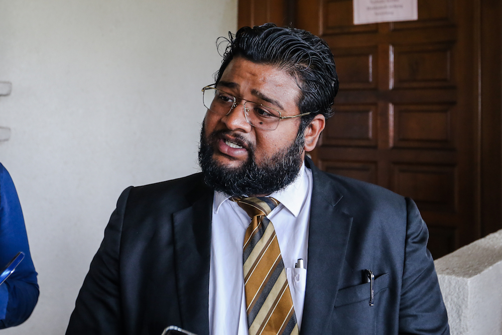 Lawyer Sivahnanthan Ragava speaks to reporters at the Kuala Lumpur High Court December 19, 2019. — Picture by Firdaus Latif
