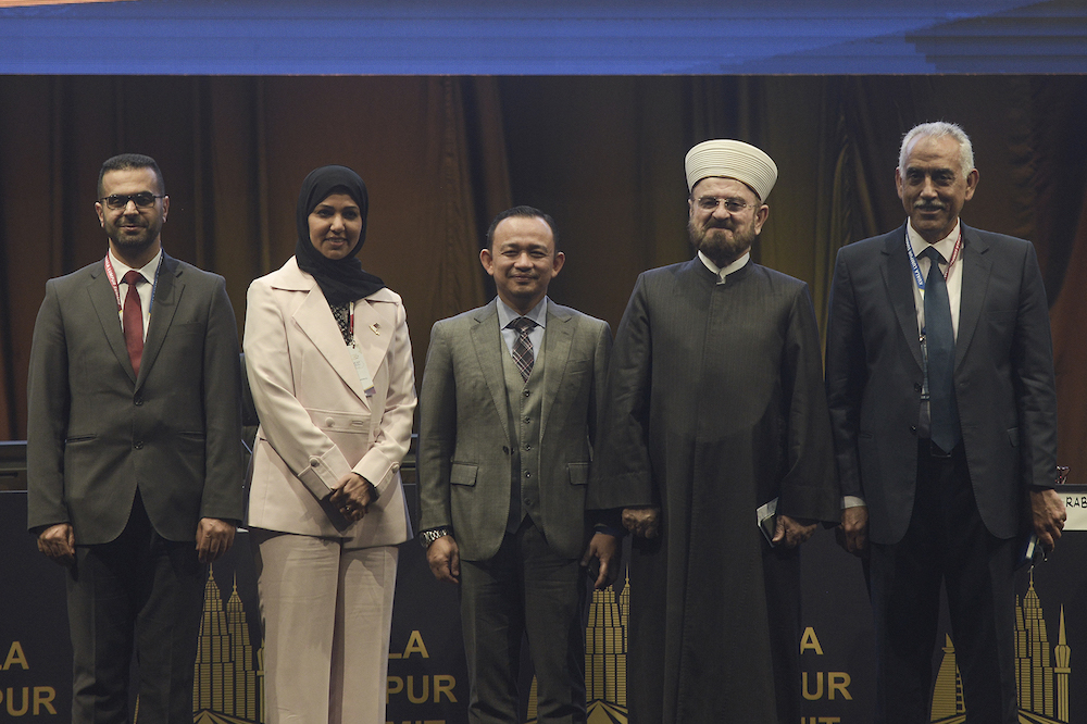 Maszlee Malik (centre) with speakers (from left) Rabee Hamu, Henda Abd Rahman Al-Muftah, Ali Muhyealdin Al Quradaghi and Jamal Kilani after a special session on the second day of the Kuala Lumpur Summit 2019 December 20, 2019. u00e2u20acu201d Picture by Miera Zulyana