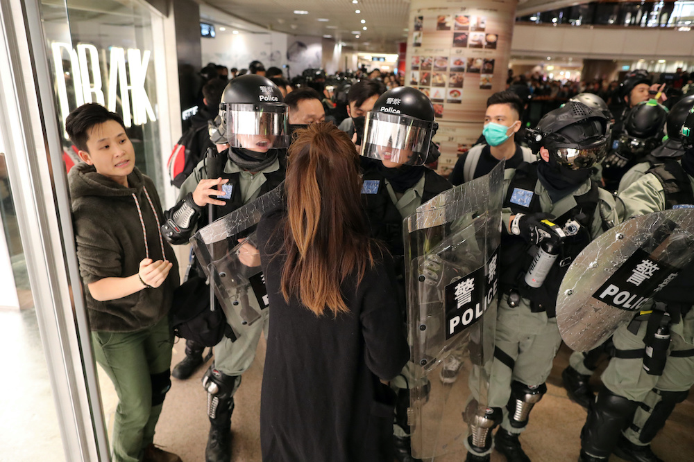 Riot police push back a shopper as Hong Kong protesters march in Harbour City shopping mall in Hong Kong, China, December 21, 2019. u00e2u20acu201d Reuters pic