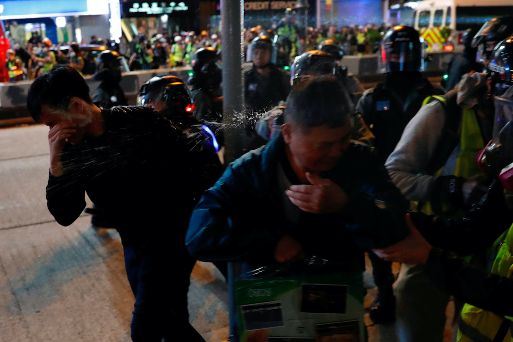 Men who got pepper sprayed by riot police reacts during an anti-government protest on Christmas day in Hong Kong, China December 25, 2019. u00e2u20acu201d Reuters pic