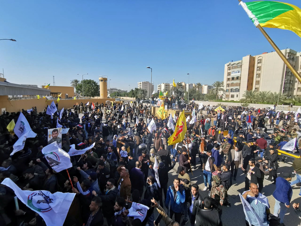 Protesters and militia fighters gather to condemn air strikes on bases belonging to Hashd al-Shaabi (paramilitary forces), outside the main gate of the US Embassy in Baghdad, Iraq December 31, 2019. u00e2u20acu201d Reuters pic