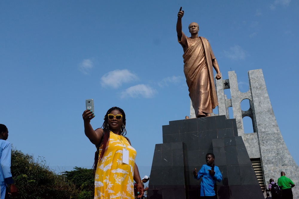 A member of a heritage tour group, travelling to Ghana to explore their ancestral roots, takes a selfie under the statue of Ghana's first president Kwame Nkrumah in Accra, August 7, 2019. u00e2u20acu201d Reuters pic 