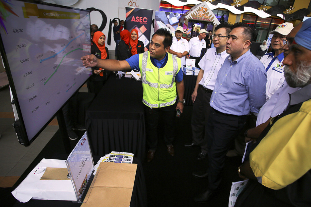 Transport Minister Anthony Loke being briefed by PLUS Malaysia Berhad Traffic Safety Department deputy manager Yusoff Ahmad about road accident statistics in Seremban December 14, 2019. u00e2u20acu201d Bernama pic     