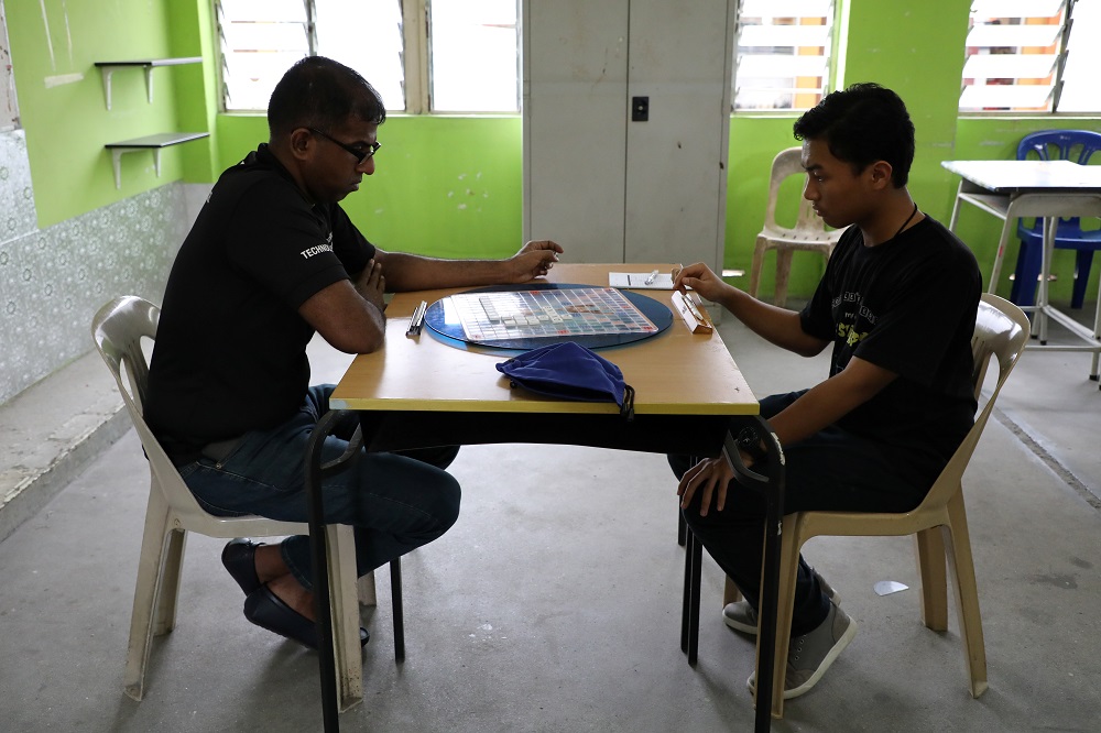 Scrabble player Tengku Ariff Shah (right) and his coach Ganesh Asirvatham practise before the WESPA Youth Cup 2019 in Kuala Lumpur November 30, 2019. ― Reuters pic