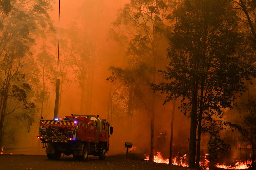 Fire trucks are seen during a bushfire in Werombi, 50 km southwest of Sydney, Australia, December 6, 2019. u00e2u20acu201d AAP Image/Mick Tsikas via Reuters
