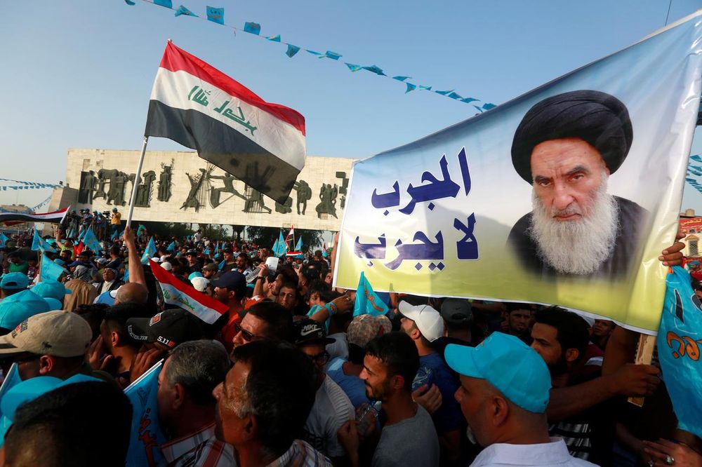 Supporters of the Al Sairun Party, hold a poster of Iraqu00e2u20acu2122s top Shiu00e2u20acu2122ite cleric, Grand Ayatollah Ali al-Sistani, while attending a campaign rally, ahead of the parliamentary election in Baghdad, Iraq May 4, 2018. u00e2u20acu201d Reuters pic