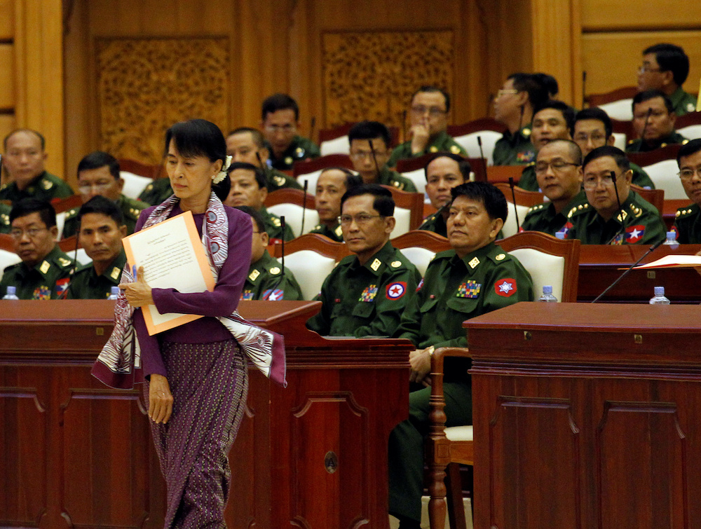 File photo of pro-democracy leader Aung San Suu Kyi walking to take an oath at the lower house of parliament in Naypyitaw, Myanmar May 2, 2012. u00e2u20acu201d Reuters picnn