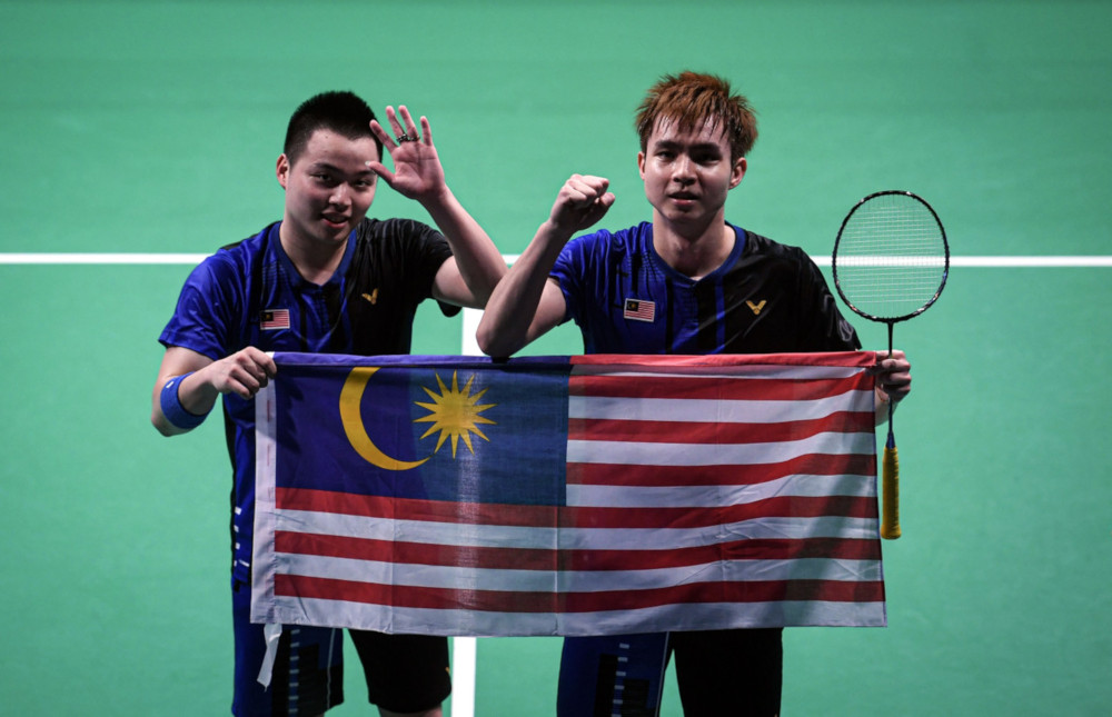 National doubles pair Aaron Chia and Soh Wooi Yik celebrate their win after defeating Thailand in the menu00e2u20acu2122s doubles final at the Muntinlupa Sports Complex December 9, 2019. u00e2u20acu201d Bernama pic
