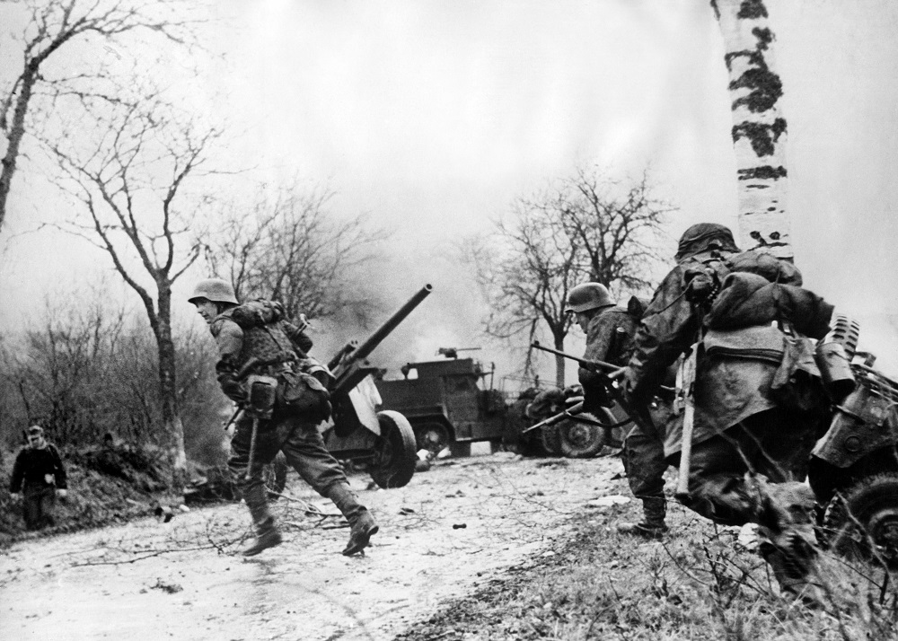This file photograph taken on December 16, 1944 shows German infantrymen crossing a road somewhere on the western Front during their drive into the US lines during The Battle of The Bulge u00e2u20acu201d The Ardennes Counteroffensive, in western Belgium. u00e2u20acu201d AFP pic 