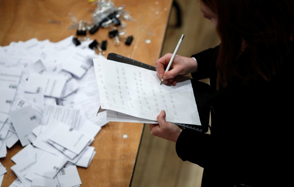 An activist checks off votes on a clipboard as ballots are tallied at a counting centre for Britain's general election in Waltham Forest Town Hall, Walthamstow, Britain December 12, 2019. u00e2u20acu2022 Reuters pic
