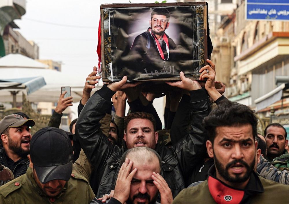 Iraqi mourners carry the coffin of a protester and citizen journalist, who was killed during a demonstrations the previous day in Baghdad, during his funerary procession in the central holy Shiite shrine city of Najaf on December 7, 2019. u00e2u20acu201d AFP pic