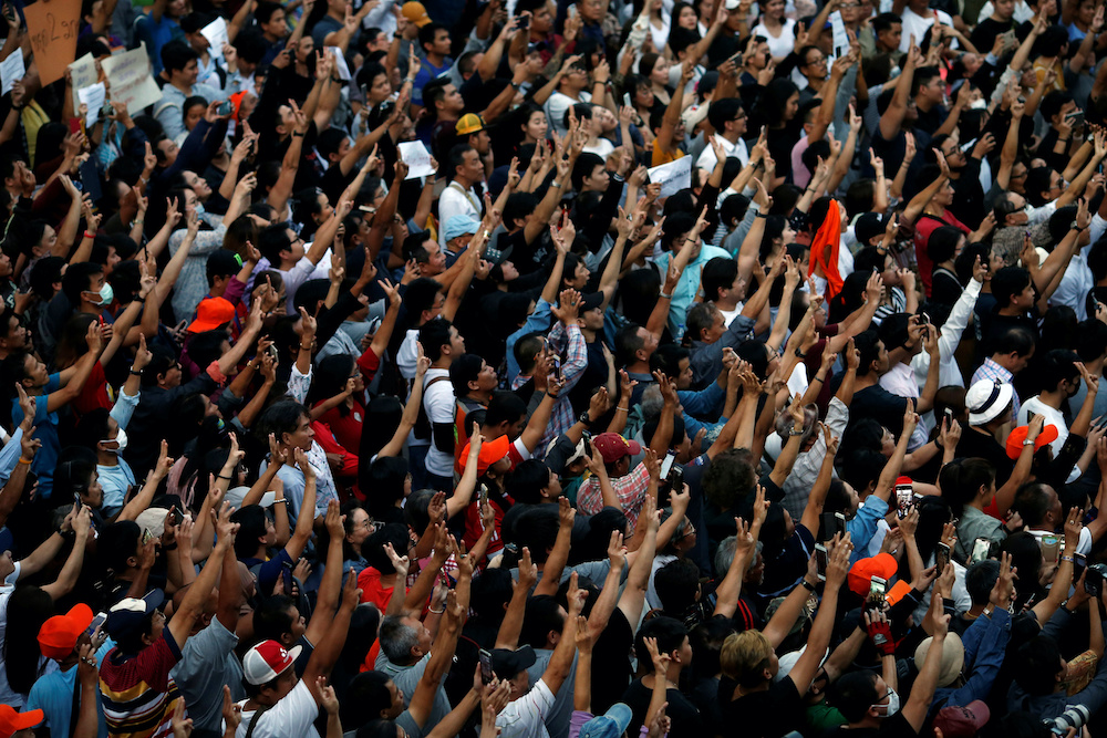 Supporters wave their hands during an unauthorised flash mob rally by the progressive Future Forward Party in Bangkok, Thailand December 14, 2019. u00e2u20acu201d Reuters picnnnn