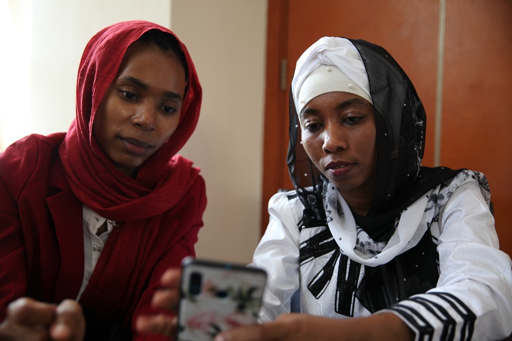 Entrepreneurs Falmata Awada and Zam-zam Djorkode give a demonstration of their mobile health app in N'Djamena, Chad, November 21, 2019. u00e2u20acu201d Thomson Reuters Foundation pic