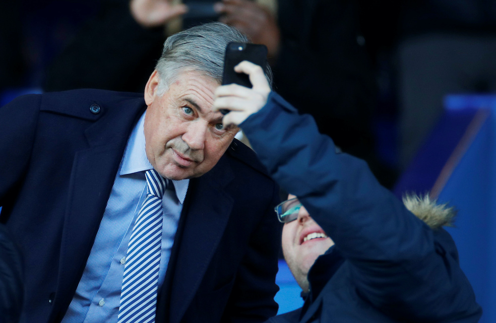 New Everton manager Carlo Ancelotti takes a selfie with a fan inside the stadium before the match against Arsenal at Goodison Park in Liverpool, December 21, 2019. u00e2u20acu2022 Reuters picnn